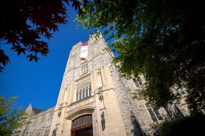 A view of Virginia Tech's Burruss Hall from below, looking up.