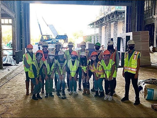 Student group Building Women in Construction on a site visit