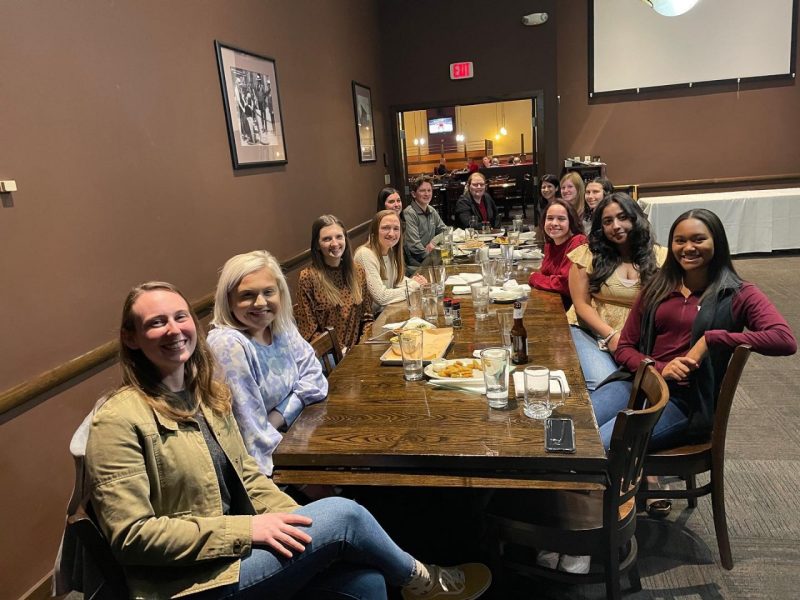 Group of students at Industry Happy Hour at a restaurant