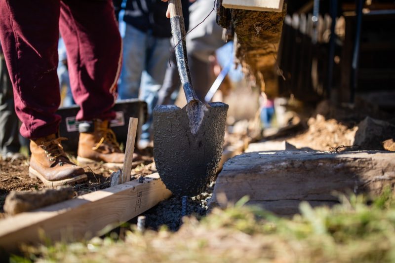 A shovel breaks ground on a work site.
