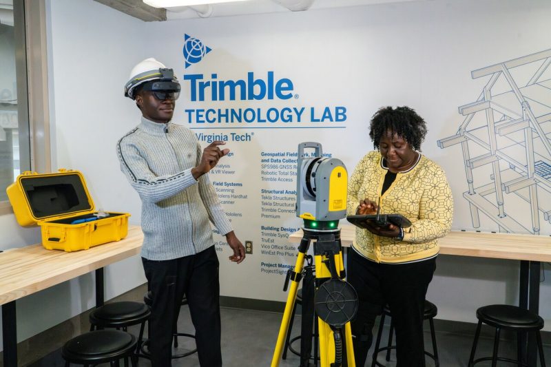 Trimble Technology Lab opens inside of Burchard Hall . A student and a profession use tablet and equipment inside of the facility. Photo by Clark Dehart for Virginia Tech.